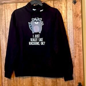 Brand new Black hoodie with graphic of raccoon. Never been worn